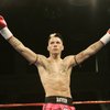 Kevin Ross raises his arms in victory after defeating Travis Garlits by unanimous decision at XFA 2 