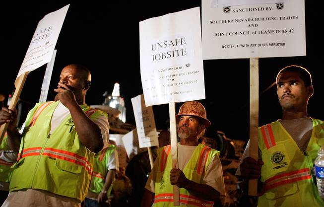 Standing outside CityCenter's contruction entrance on Frank Sinatra Drive and Rue de Monte Carlo, Laborers Local 872 members Eric Johnson, Javier Flores and Edgar Saldana participate in a picket of the project where they work.
