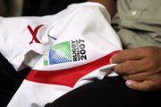 Career abroad beckons: Esikia shows a jersey from last year's Rugby World Cup played in France. An agent in France has fielded offers from two teams there and one in Italy. 