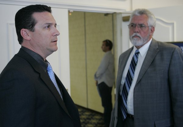 Greg McClelland, left, safety director for the Ironworkers' Compensation Program, ...