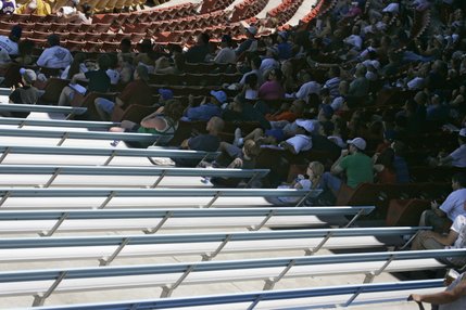 Most fans opt to sit in the shade as they watch the Las Vegas 51's take on the Tucson Sidewinders during a rare day game at Cashman Field.