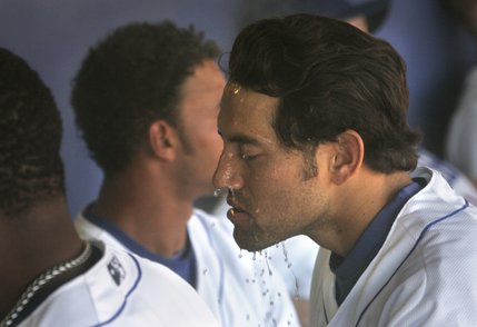 Sergio Garcia douses his face with water to try and cool off before taking the field. 