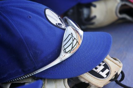 Las Vegas 51s center fielder Paul Xavier's sunglasses and cap await the next inning on the dugout bench. 