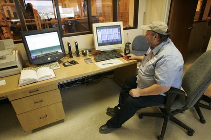 Kelvin Spendlove monitors a machine that compresses solid waste at  the Clark County Water Reclamation District's solids de-watering facility.