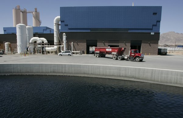 A truck laden with compressed waste leaves the Clark County ...