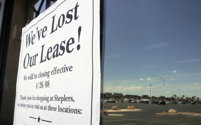A sign explains the closing of Sheplers Western Wear. The center's owners haven't revealed plans for the half-empty plaza.