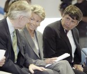 When Pat Mulroy, center, got involved in the land act, she demanded that it contain a clause diverting 10 percent from land sales to her Southern Nevada Water Authority. Mulroy is seen with Reid, left, and Interior official Bennett Raley in 2004.