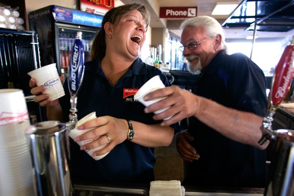 Bartenders Kelly Miller, left, and Blu Sandford joke around while ...
