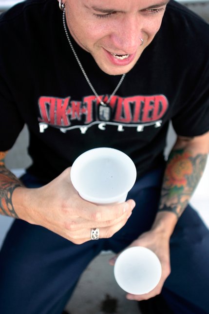 Joshua Garcia holds two 12 oz. dollar beers during Dollar Beer Night at Cashman Field for the Las Vegas 51's game against the Portland Beavers. Customers are only allowed to buy two beers at a time. 