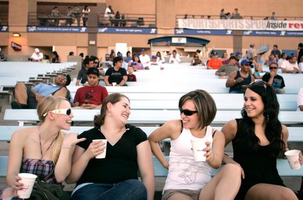 Co-workers Sadie Everts, from left, Julia Stevens, Kelly Chenin, and Sarah Dziuba enjoy their 12 oz. dollar beers during Dollar Beer Night at Cashman Field for the Las Vegas 51's game against the Portland Beavers. The ladies work together at the Cheesecake Factory in Henderson. 