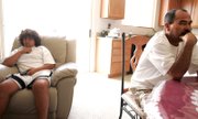 Daniel Acero, 14, watches a soccer game at home on TV with his father, Geraldo, on Monday. Daniel had hoped to catch the eye of a recruiter at the regional tournament this week in Hawaii, but his championship-winning youth team, the Vegas United, was forced to back out at the last minute.