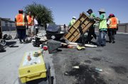 Getting rid of large debris was part of Saturday's cleanup, which followed improvements to the neighborhood such as new streetlights.