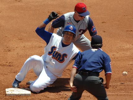Jacksonville Suns Juan Gonzalez steals second base as Tennessee Smokies shortstop Matt Matulia mis-handles a throw during a Suns victory at the Baseball Grounds of Jacksonville, Florida. 
