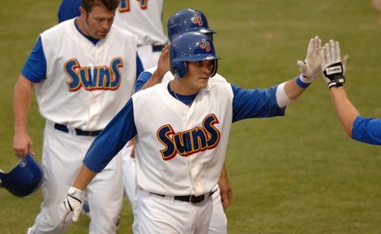 Jacksonville Suns' Lucas May is congratulated after a three run homer.
