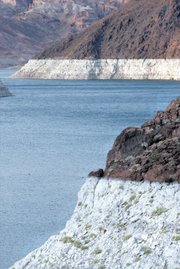 
Near the Hoover Dam, the difference in the color of the rocks shows how high the water level in Lake Mead has been. Drought on the Colorado River, combined with increased water use in booming Las Vegas, has reduced the reserves and has Las Vegas Valley water managers searching for options. 