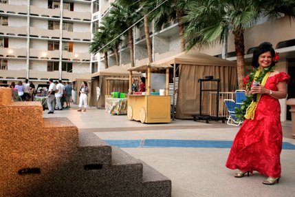 Luau creator and host Rozita Lee stands side stage during the Imperial Luau held poolside at the Imperial Palace's Shangri-la pool. The luau has been held at the Imperial Palace since 1991.