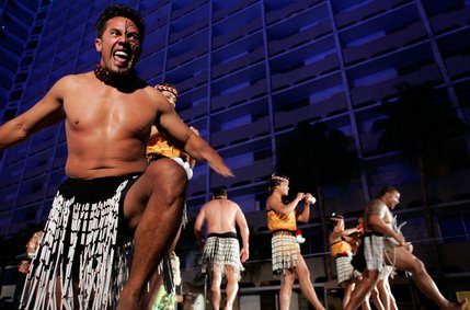 Samoan dancer Foi Tuitama, left, performs a warrior dance during the Imperial Luau held poolside at the Imperial Palace's Shangri-la pool.