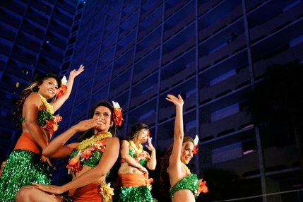 Polynesian dancers Nani Ayakawa, from left, Tiffany Dixon, Roxanna Ayakawa, and Kim Smith perform during the Imperial Luau held poolside at the Imperial Palace's Shangri-la pool.