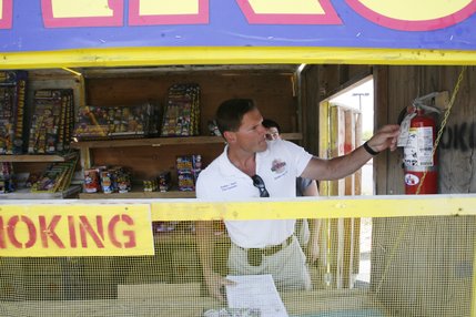 Henderson fire inspector Bradley Stasik checks out a fireworks stand before giving the OK for it to open for business.
