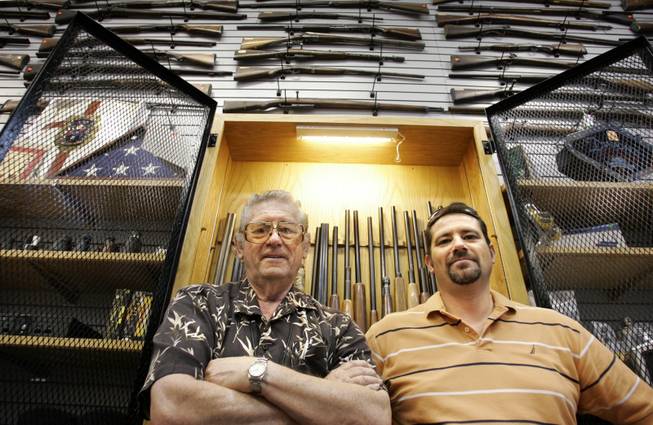 George Bramlett, left, owner of Bargain Pawn in North Las Vegas, with his son, general manager David Bramlett, says people who've never pawned anything before are now desperate for cash. 