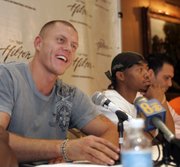 Kaspars Kambala, left, former UNLV basketball player turned boxer, speaks during a news conference at the Las Vegas Hilton Wednesday, July 2, 2008. 