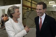 Pat Mulroy, general manager of the Southern Nevada Water Authority, chats with Michael Yackira, president and chief executive of Sierra Pacific Resources, during Monday's grand opening of the Ausra manufacturing facility.
