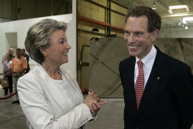 Pat Mulroy, general manager of the Southern Nevada Water Authority, chats with Michael Yackira, president and chief executive of Sierra Pacific Resources, during Monday's grand opening of the Ausra manufacturing facility.