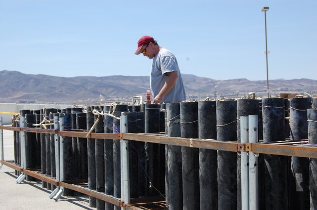 A Grucci fireworks technician preps for one of five Fourth of July shows at the Sunset Station Casino in Henderson, NV.  Over 60 hours of preparation goes into the nine minute Grucci fireworks display each year. 