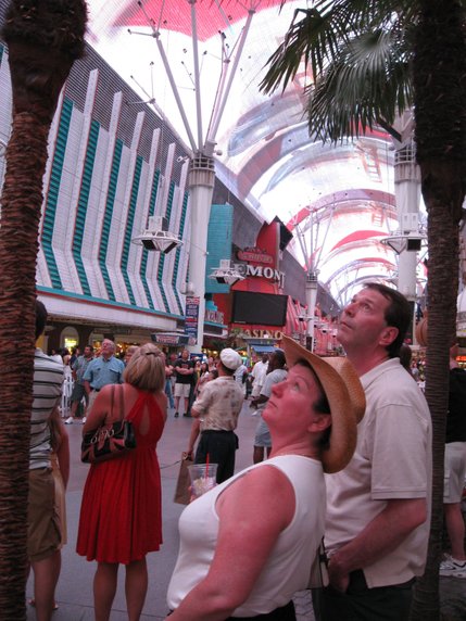 Tourists Carol Simpson and Colin Flicker, both from Bramford, Ontario, watch Fremont Street's Viva Vision.
