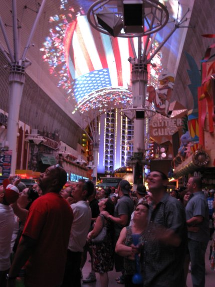 An American flag flies high above Fremont Street Thursday as holiday weekend festivities get underway.