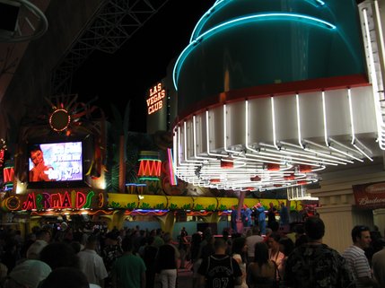 Customers wait in line in front of Binion's Casino, taking in the NiteKings' set as the group performs nearby.