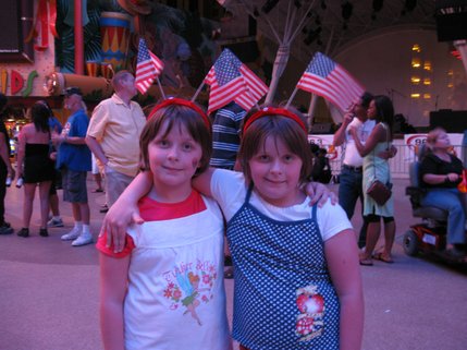 Twin sisters Megan and AnnDee Gladu of Idaho Falls, Idaho, proudly wear their stars and stripes to the Independence Day celebrations on Fremont Street. 