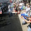 People spray water on each other during the 60th annual Damboree parade parade in Boulder City.