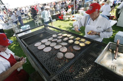 Bob Morwick, left, and Bob Waits, of Boulder City's Elks Lodge, cook hamburger patties for those attending the 60th annual Damboree parade in Boulder City.