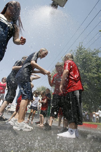 Kids stay cool during the 60th annual Damboree parade, Boulder City's Fourth of July celebration.