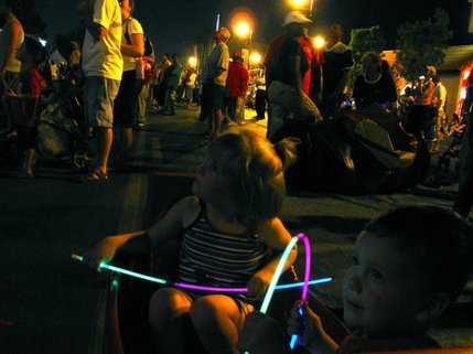 Mandy Gamboa, 4, and her brother, Noah Gamboa, 2, watch the Independence Day fireworks from the comfort of their little red wagon. 