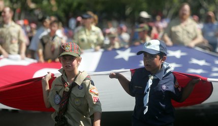 The Boy Scouts of America from the Big Horn District march in the Summerlin Patriotic Parade with a large American flag on July 4.