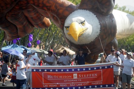 An eagle balloon flies above Hutchison and Steffen Attorneys during the Summerlin Patriotic Parade on July 4.  
