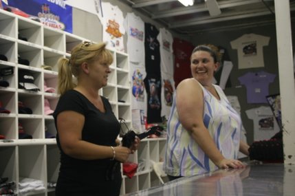 Theresa Rogers and a fellow speedway employee manage the gift shop Thursday.