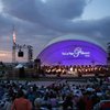Under the setting sun, the Las Vegas Philharmonic orchestra entertains thousands of spectators while performing a variety of patriotic songs during the 10th Anniversary Star Spangled Spectacular concert at Hills Park in Summerlin.