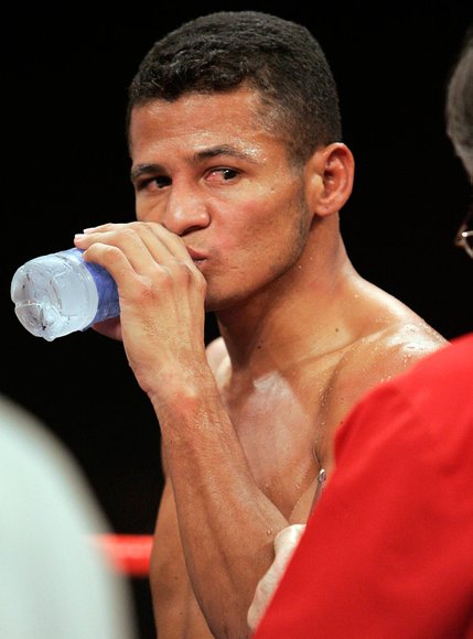 Ricardo Torres stands in the ring after losing to Kendall Holt by KO in the first round of their WBO junior welterweight championship at Planet Hollywood.