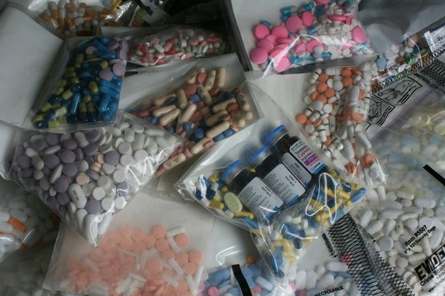 Prescription drugs confiscated by the coroner's office in the past six weeks are displayed at the coroner's offices  Wednesday.