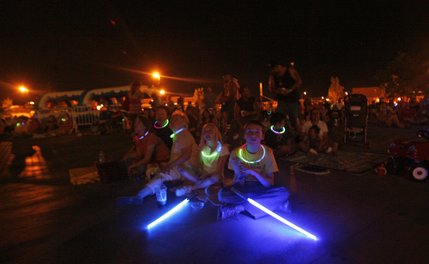 Spectators watch the fireworks Friday night in Henderson. 