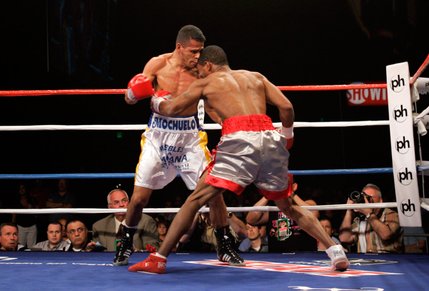 WBO junior welterweight champion Ricardo Torres, left, and Kendall Holt battle during their title fight at Planet Hollywood.