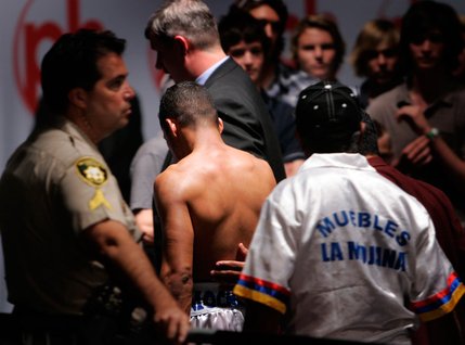 Ricardo Torres walks away from the ring after losing his WBO junior welterweight title to Kendall Holt at Planet Hollywood.