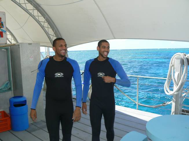 UNLV basketball players Matt Shaw, left, and Ren&#233; Rougeau prepare to plunge into the Coral Reef during the team's trip last summer to Australia. Shaw tore the ACL in his right knee just before the trip, and couldn't have surgery until he returned, as he waited for the swelling to go down.