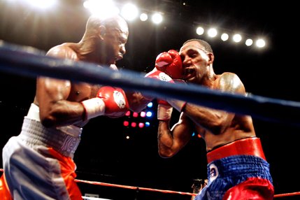 Kevin Kelley, left, and Jaime Palma fight during a lightweight boxing match at the Las Vegas Hilton.