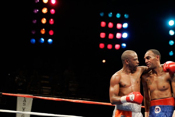 Kevin Kelley, left, hugs Jaime Palma after their lightweight boxing ...