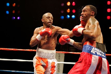 Kevin Kelley, left, and Jaime Palma fight during a lightweight boxing match at the Las Vegas Hilton.