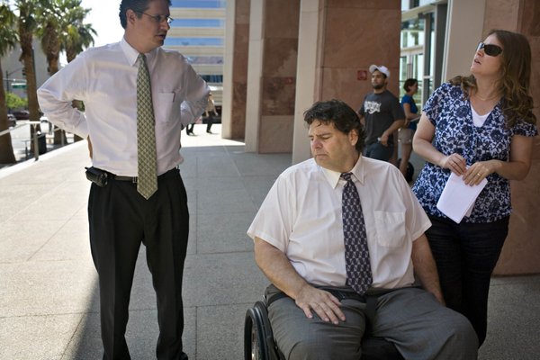 Tom and Kathy Urbanski talk with their attorney, Matthew Dushoff, ...